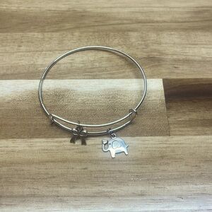silver adjustable bangle bracelet with elephant and bow tie charms